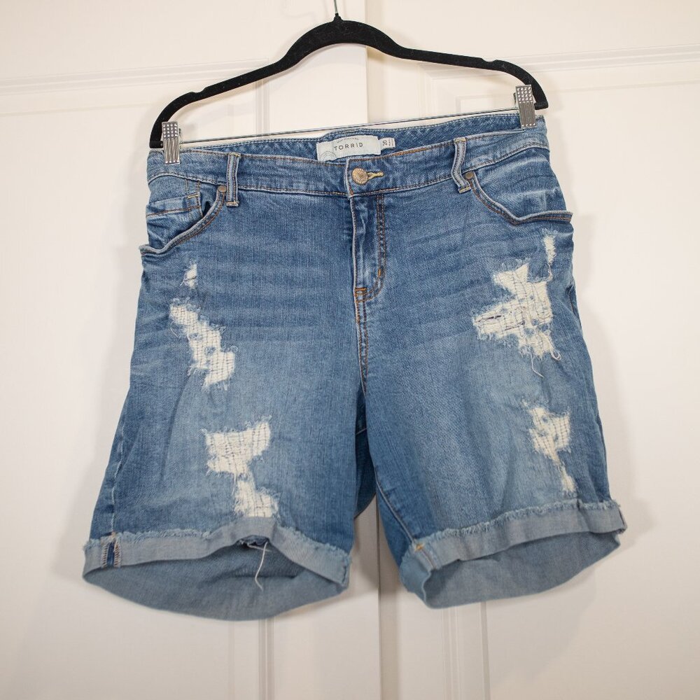 Torrid boyfriend fit mid thigh shorts with distressed details